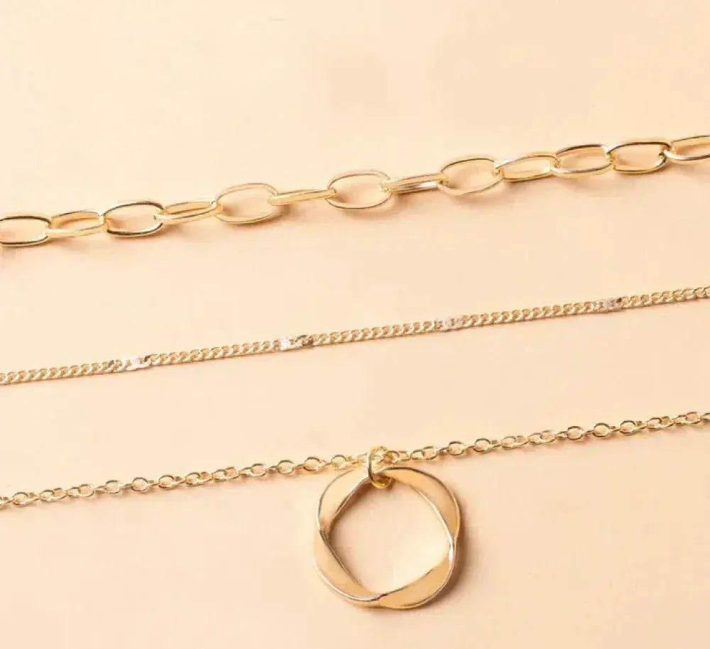 Collier vintage en chaîne dorée et pendentif